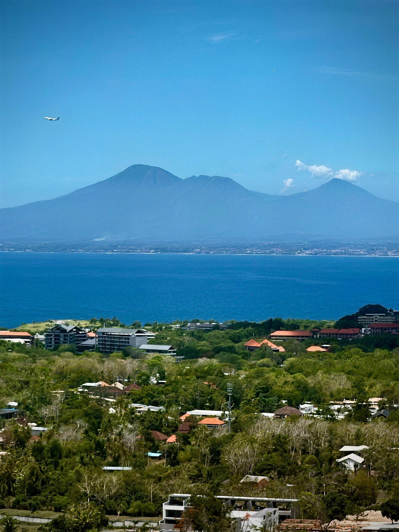 Mountains across the strait, with the ocean below